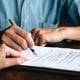 A person signs a last will with the help of a San Jose attorney