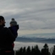 A parent with shared custody holds their child as they overlook the mountains