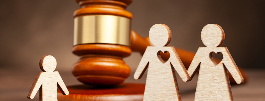 Child Custody in Same-Sex Divorce Represented By Abstract Cut-out Shapes