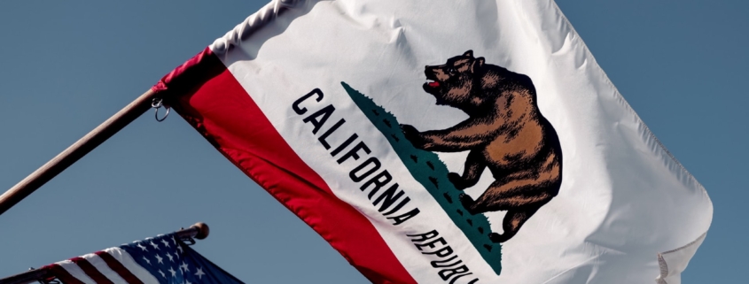 California Flag waving next to American flag, durable power of attorney