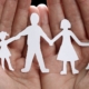 Paper chain of family illustrating child custody concept