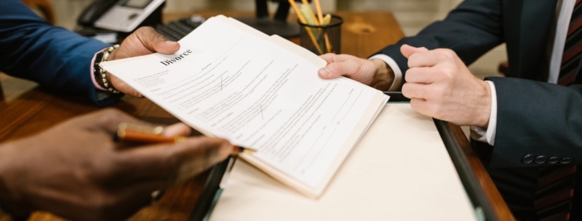 Person signing divorce agreement