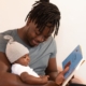 Biological father reads son a book