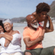 Grandparents and grandchildren hugging while siting on the beach. Can Grandparents Sue for Visitation Rights?