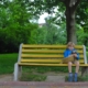 Child alone on bench. Child Custody After the Loss of a Guardian.