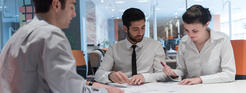 signing contract on partners back, young couple on business meeting with life insurance and bank loan agent at modern office interior. collaborative divorce