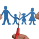 Man and womans hands cutting paper chain family concept for divorce and child custody battle. children
