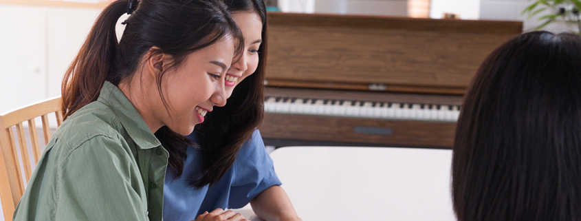 Happy asian lesbian couple sign contract. It's crucial for LGBTQ+ couples to navigate the complexities of estate planning to ensure their loved ones are protected.