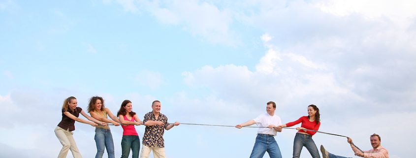 A tug-of-war image symbolizing sibling rivalry, emphasizing challenges in fair inheritance distribution and estate planning.