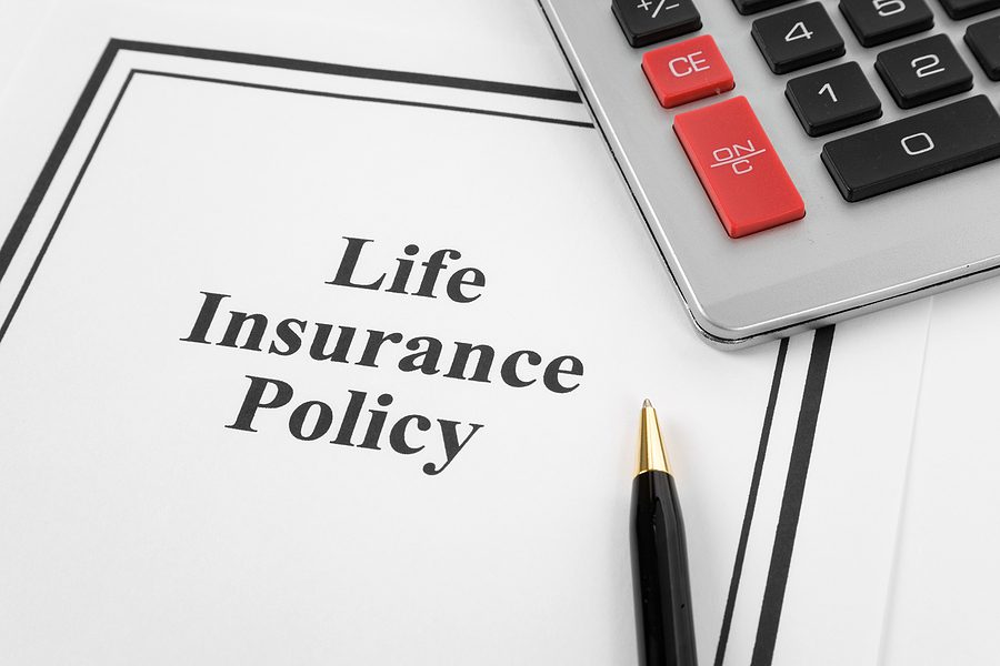 A close-up of a life insurance trusts policy document with a pen placed on top, symbolizing financial planning and protection for loved ones.