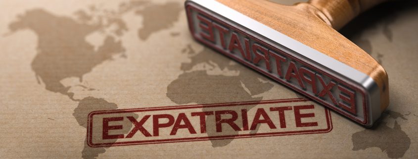 Expatriate Estate Planning concept showing a world map with the word “expatriate” and a rubber stamp, representing international legal and financial planning.