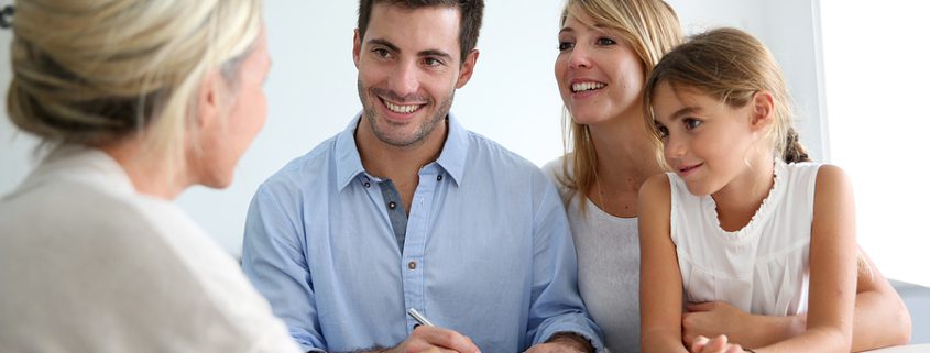 Family meeting with a real estate agent discussing estate planning and choosing the right executor for managing assets and investments