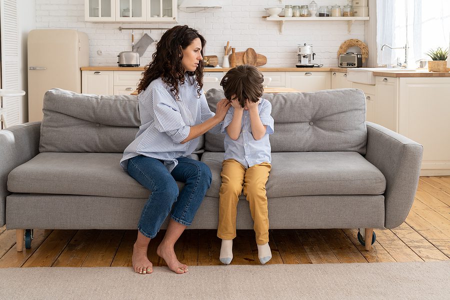 Melanie’s Law concept showing a mother comforting an upset child, representing family protection and emotional impact of domestic violence