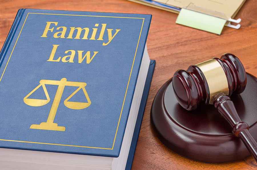Family law book and gavel symbolizing Quebec's family tribunal reforms, child custody cases, and evolving family court systems.
