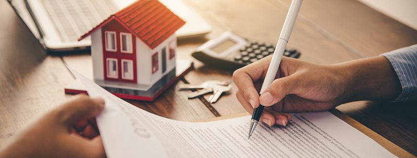 Estate Planning Pitfalls concept with couple signing real estate and estate planning documents with advisor.