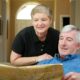 Retired couple planning finances and reviewing pension pots for estate and retirement planning.