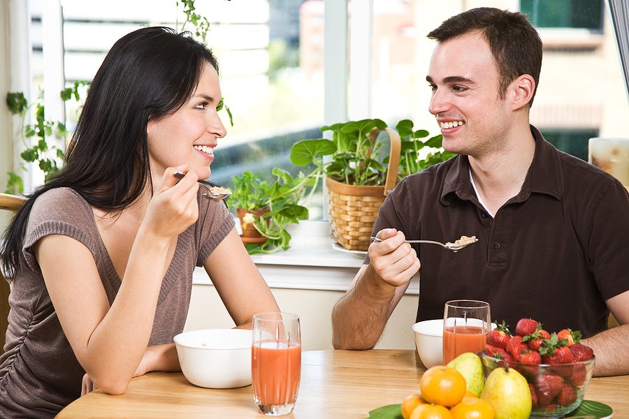 Couple eating breakfast together representing cohabitation and shared living.