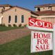 Real Estate sold sign displayed in front of a newly built home, symbolizing a successful property sale and homeownership.