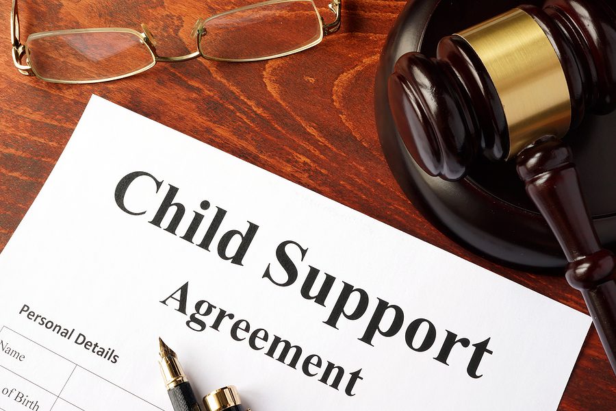 Child support agreement paperwork representing legal considerations for parents working in the gig economy.