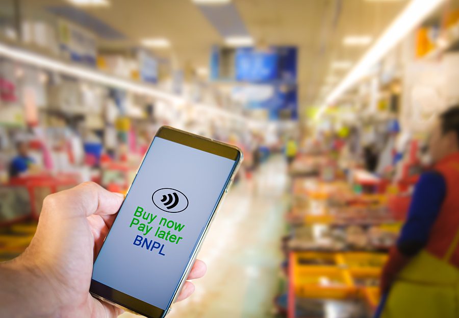 Online shopping and buy now, pay later concept representing marital debt.