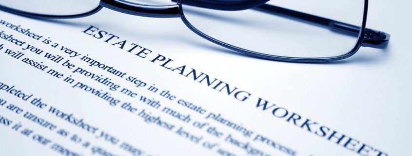 Reading glasses resting on an estate planning worksheet for child-free individuals planning ahead