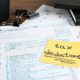 Tax Deductible expenses concept with tax deductions paper and individual tax return form on a table.