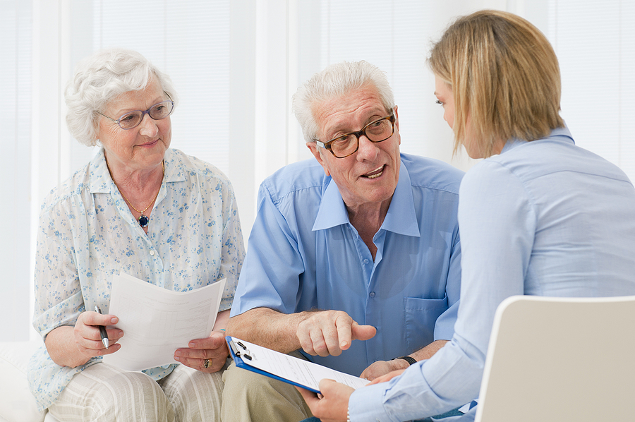 Federal retirement laws reviewed by an advisor with a retired couple planning their future investments