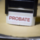 Probate process paperwork stamped “probate” in a thick file folder